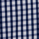 100% poplin cotton in a midnight gingham pattern ideal for shirts, dresses, skirts, pants, and unstructured blazers.