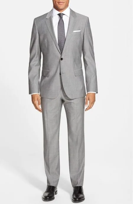 Mens 2 button suit in silk and wool blend.