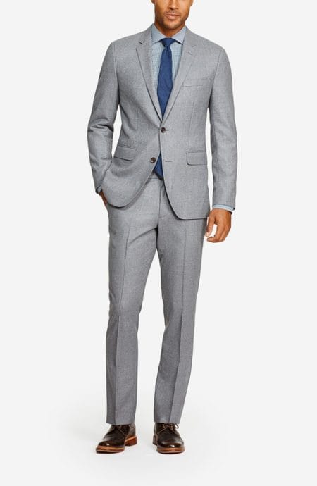 Mens grey flannel suit 2 button closure, a full front view.