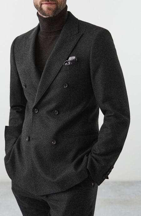 Mens double-breasted suit jacket full front view.