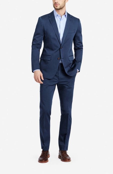 Slim fit unstructured cotton suit custom-made in single-breasted style with 2 back vents.
