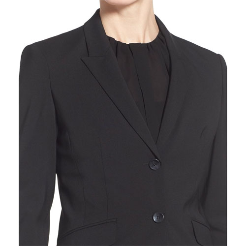 Round peak lapels with the low gorge in a women’s jacket.
