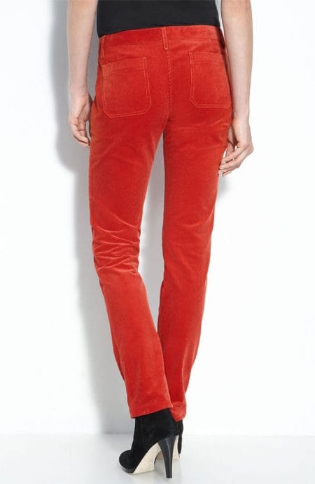 Red velvet mid-rise womens skinny pants with pockets full back view.