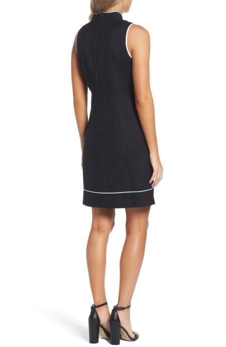 White piped trim sheath dress A-line with V-neck full back view.