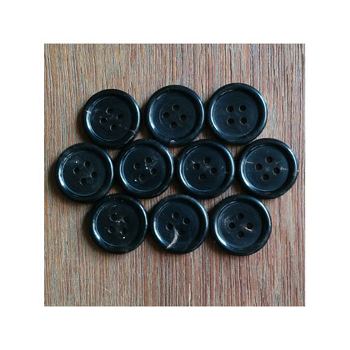 Hand made black horn buttons for garments.