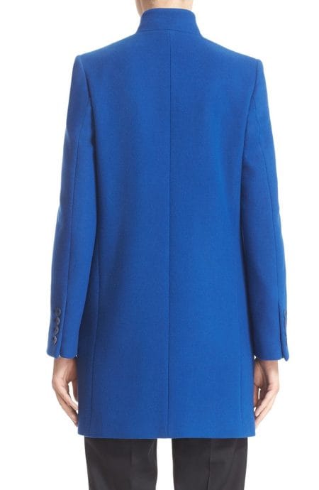 Back view of the custom-tailored Cobalt Statement Coat in blue Melton wool, featuring a clean, unvented back and detailed four-button sleeve cuffs.