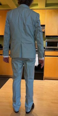 Back view of the try-on test suit for the Men's Dupioni Silk Suit, used to perfect the jacket's drape and ensure a flawless fit.