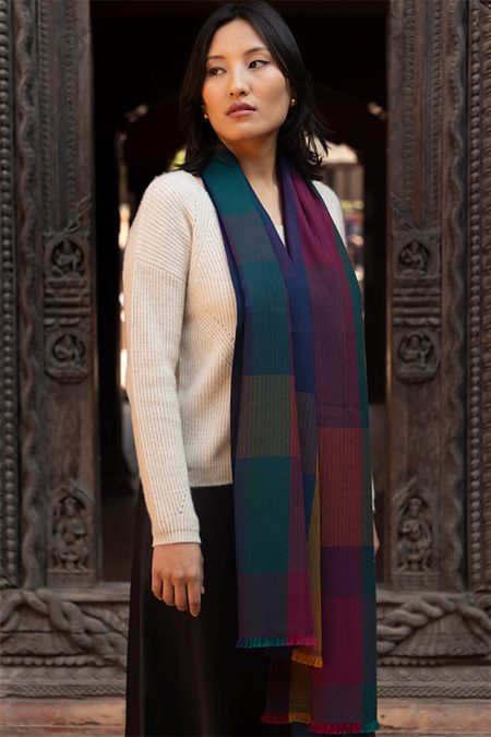 Side angle of the Kathmandu Twilight Check Cashmere Stole, highlighting its soft drape and vibrant checkered pattern in deep teal, maroon, and navy hues.