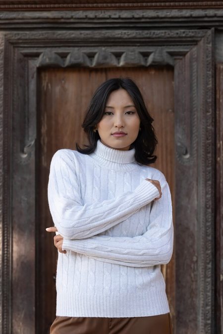 Front view of a Baron Boutique Fog Cable Knit Cashmere Turtleneck Sweater featuring a classic fit and ribbed hem.