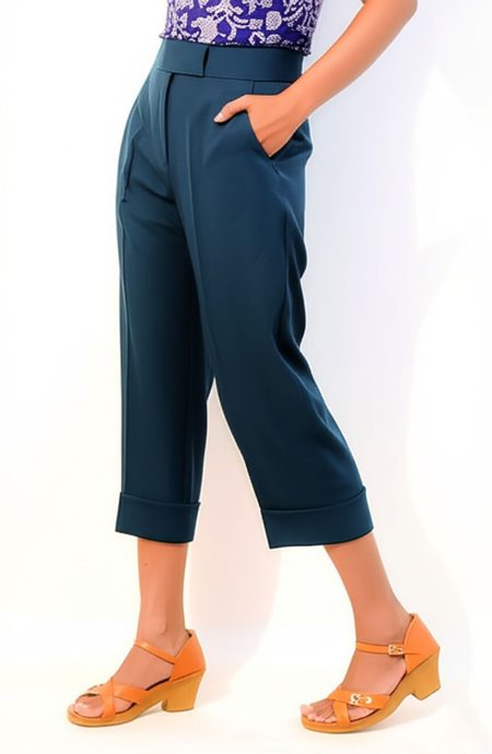 Profile view of 13th Doctor Jodie Whittaker replica cropped pants. The teal mohair wool trousers feature a prominent 2-inch wide waistband, a clean side profile revealing the side slant pockets, and a straight-leg cut. The cropped length falls just above the ankle, showcasing the hem.