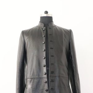 A close-up detail shot of the mandarin collar and button placket on the genuine leather Matrix Reloaded coat.