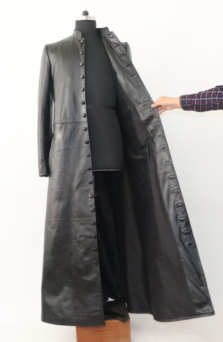 The Matrix leather coat held open to reveal the full satin lining and expert interior construction.