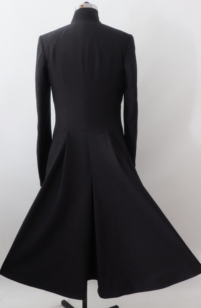 Back view of a men's black wool flared tailcoat, highlighting the fitted waist and long, flowing tails.