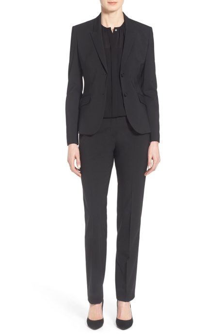 Full front view of The Performance Tropical Wool Pantsuit, custom-tailored for women to create a sharp, modern silhouette in breathable black tropical wool.