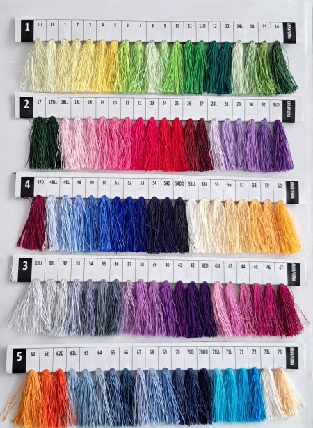 Baron Boutique custom cashmere color chart, rows 1 to 5: hand-dyed yarn tassels in yellows, greens, pinks, purples and blues.