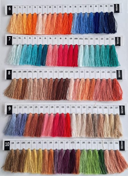 Baron Boutique custom cashmere color chart, rows 6 to 10: hand-dyed yarn tassels in oranges, corals, teals, deep blues and earthy browns.