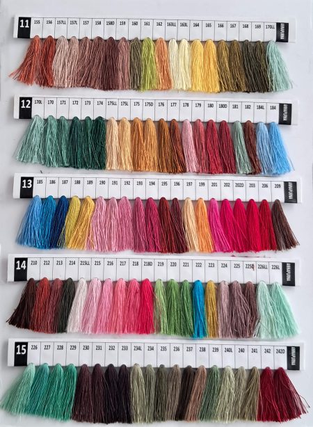 Baron Boutique custom cashmere color chart, rows 11 to 15: hand-dyed yarn tassels in earth tones, mustards, greens and magenta pinks.
