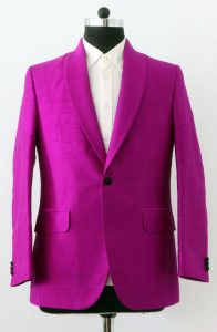 Front view of a custom-made magenta Dupioni silk tuxedo jacket with a shawl collar and single button closure.