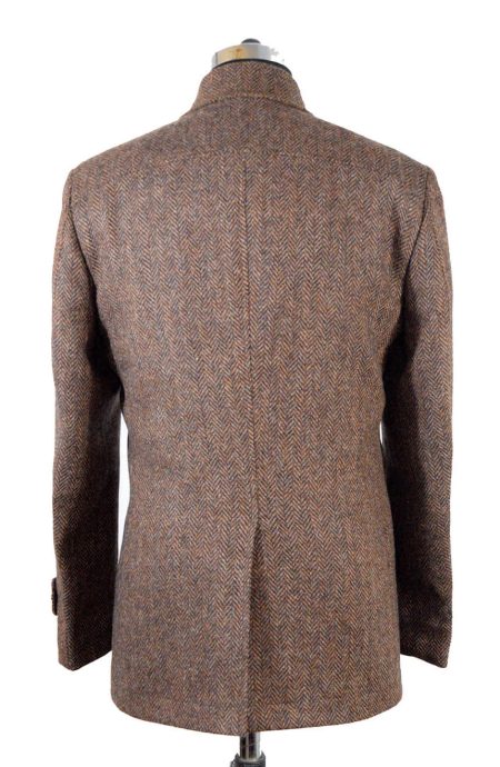 Back view of mens herringbone car coat in brown tweed wool showing V-shaped weave pattern and center back vent.