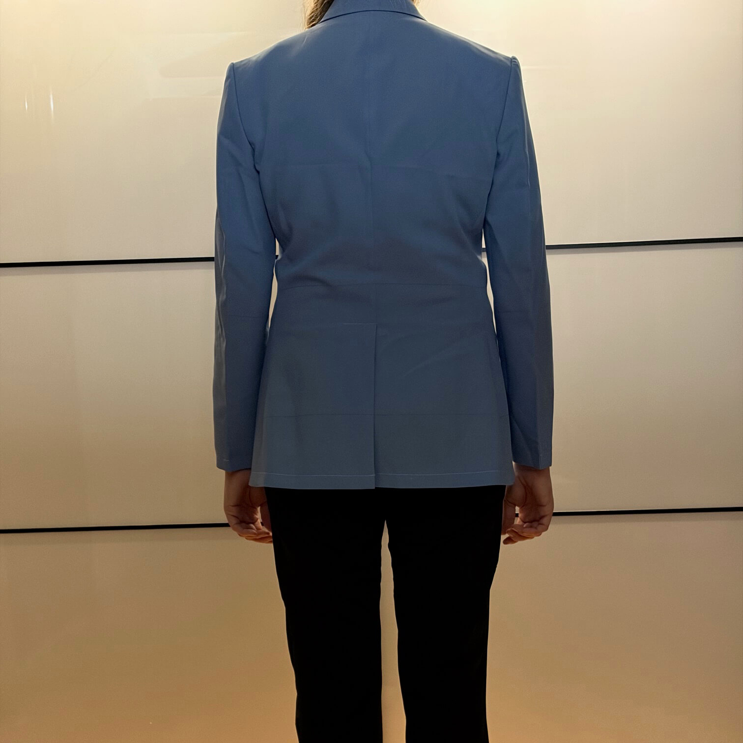 Women's dupioni silk blazer test garment back view showing center vent and tailored fit across shoulders