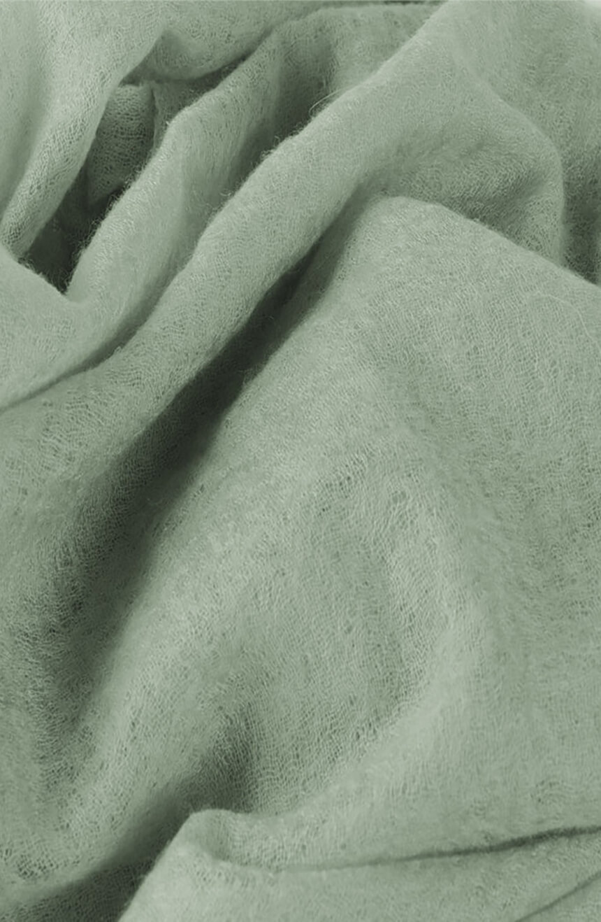 Handwoven willow green cashmere scarf shawl closeup weave view.