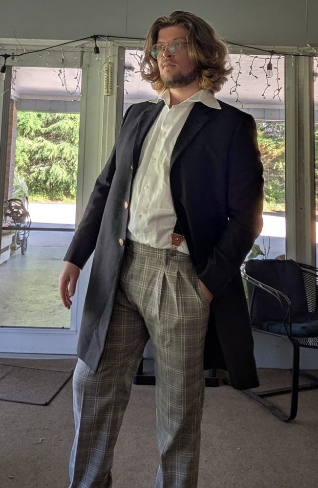 12th Doctor grey linen final coat's excellent drape illustrated by the customer for whom the coat was custom-made to measurements by Baron Boutique.
