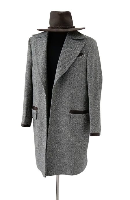 Elegant front angle of grey herringbone tweed Newt-inspired coat with premium leather pocket accents, designed for dark academia, cosplay, and fantasy-inspired wardrobes.