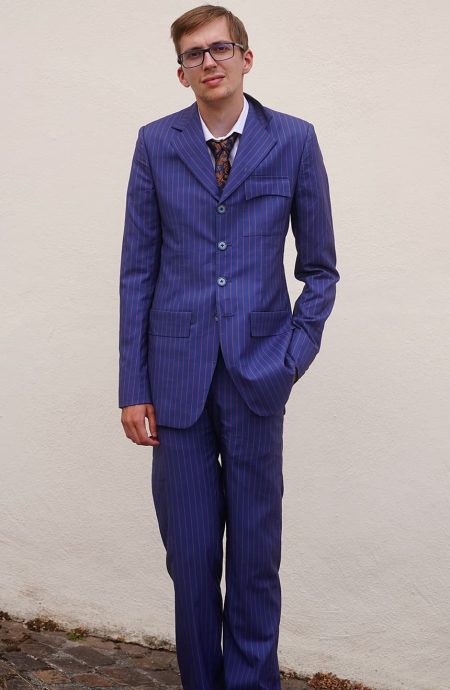 Tennant blue pinstripe suit with fine red stripe, front view: single-breasted four-button jacket, notch lapels, and matching straight-leg trousers.