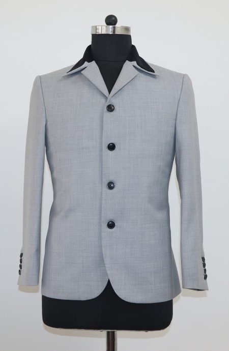 Front view of a 1960s mod grey suit jacket with a four-button closure and black velvet contrast collar, custom made by Baron Boutique.