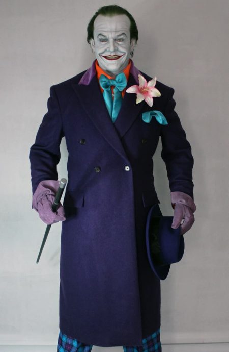 Studio front view of the 1989 purple coat replica tailored in premium heavyweight Melton wool, showcasing the classic double-breasted profile, sharp wide peak lapels, and horizontal flapped hip pockets.