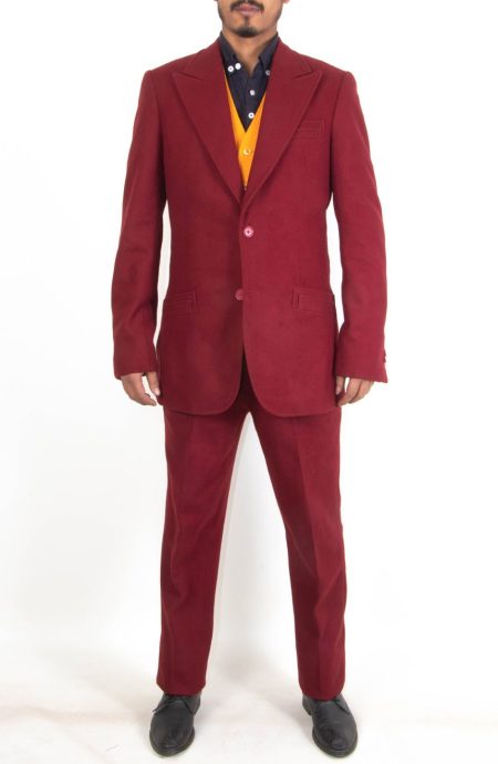 Studio front view of the 2019 burgundy suit reproduction tailored in heavy Melton wool, featuring a two-button jacket with wide peak lapels, a striking gold waistcoat, and flat-front trousers.