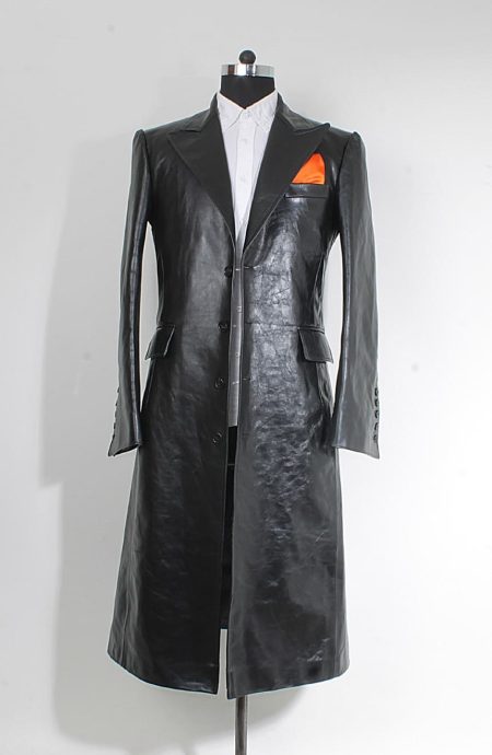 Men's long black leather coat in full-grain cow Nappa, wide peak lapel and four-button front, dramatic statement silhouette, full front view