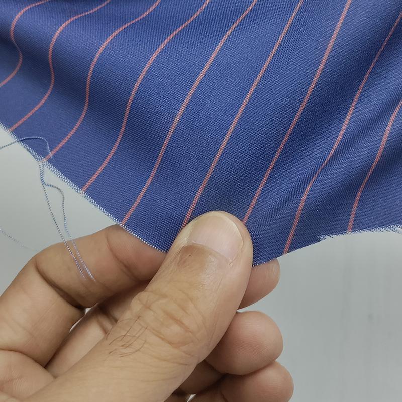 Blue cloth with red stripes for the women's Tenth Doctor blue suit, close fabric view