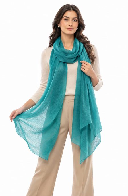 Teal featherlight cashmere scarf held open to show the full 40 by 80-inch width and the sheer open weave.