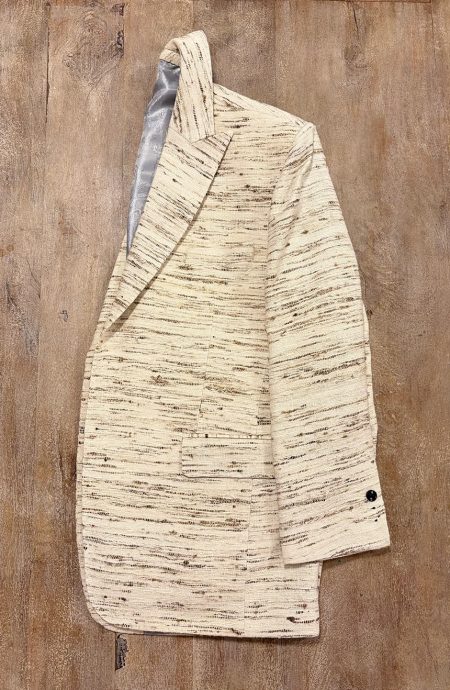 Men's raw silk blazer in unprocessed natural raw silk, side view, chest welt pocket and horizontal flap hip pocket detail