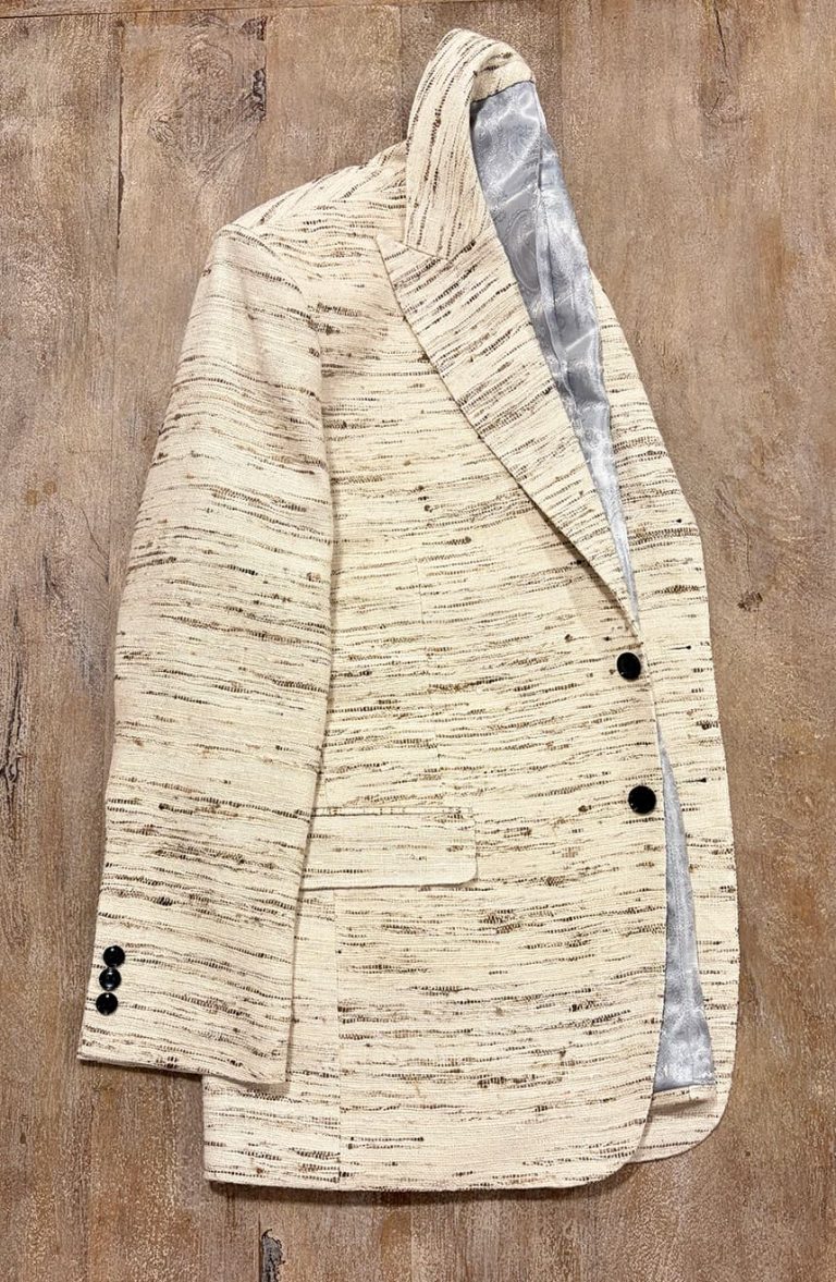 Raw silk blazer in natural ivory, front view, showing the slub grain of the silk